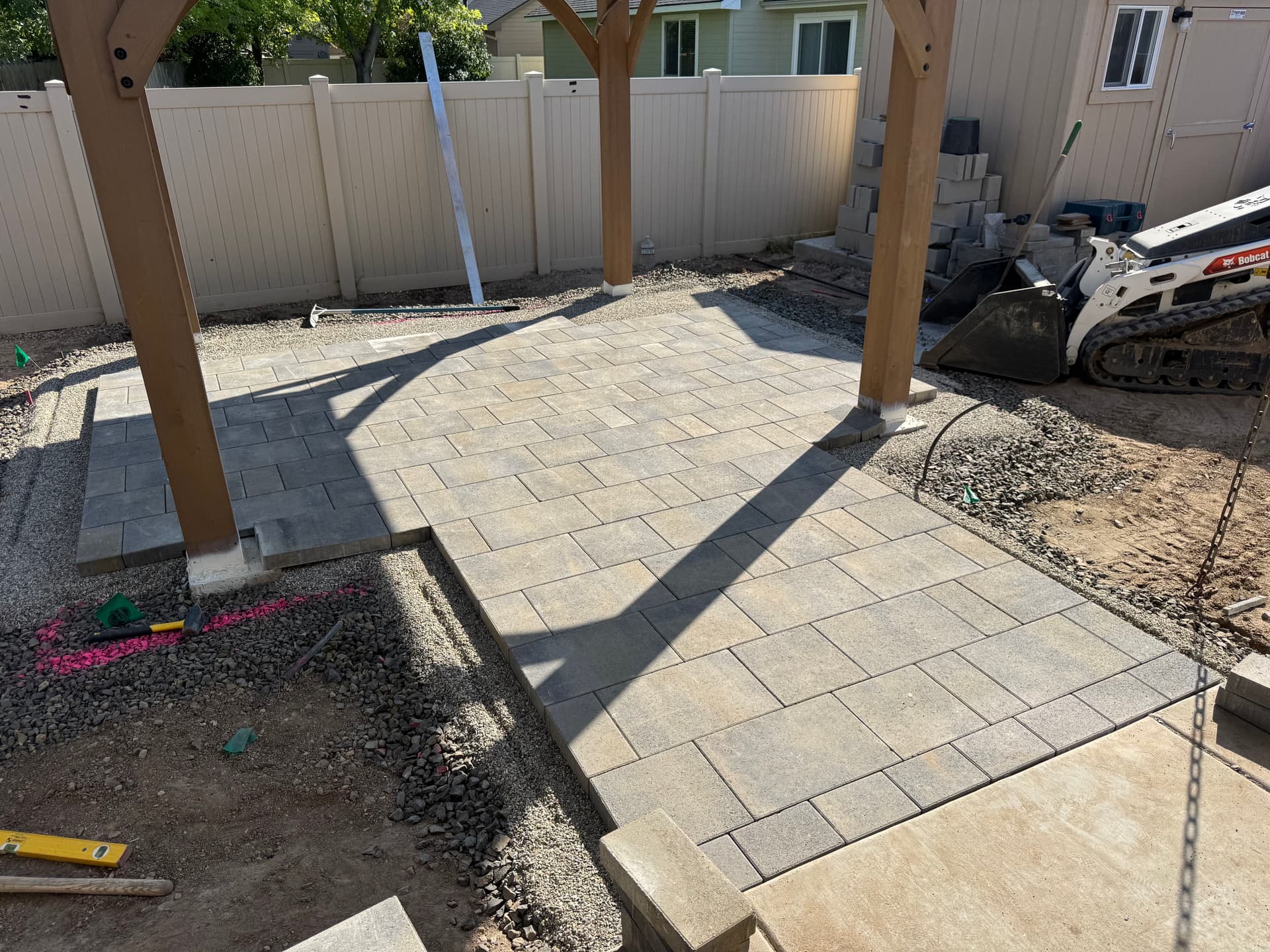 Creating Backyard Bliss with Versatile Pavers and Pergolas image